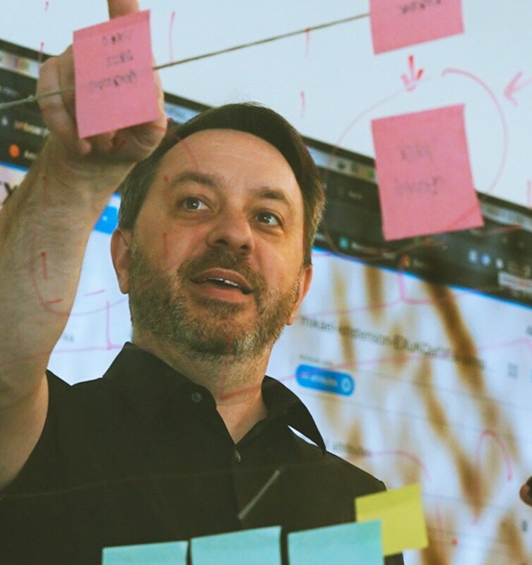 Teams collaborating on creative asset management workflows within a DAM environment