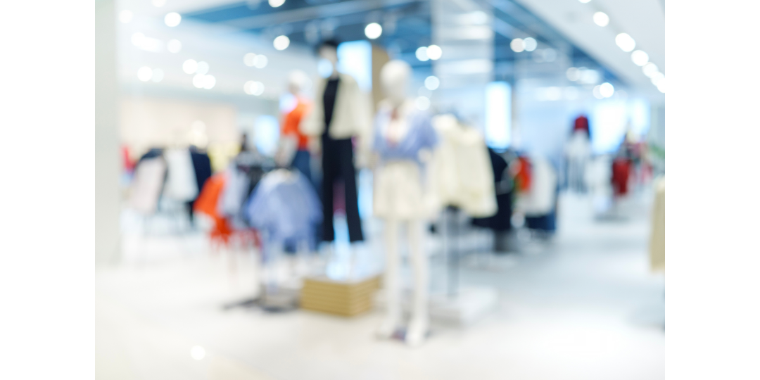 Blurred clothing display in a retail fashion store