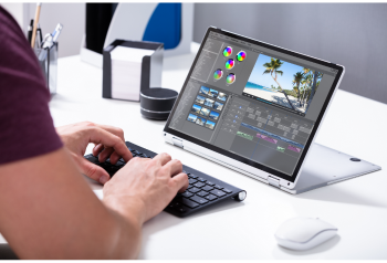 Person reviewing travel website content and destination photography on a desktop computer
