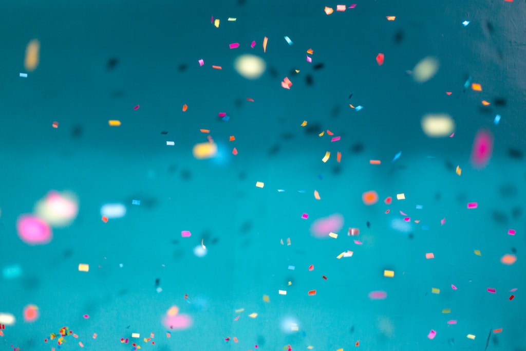 Colorful confetti falling against a teal background, illustrating NetX's 2018 Best Value in Digital Asset Management recognition.